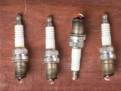 white ash on spark plugs